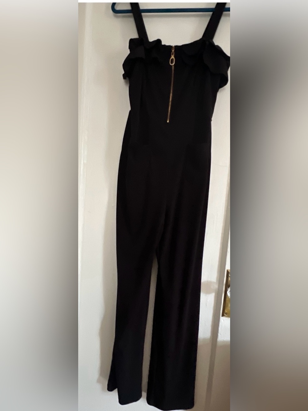 Black Ruffle-Trim Jumpsuit with Gold Zip